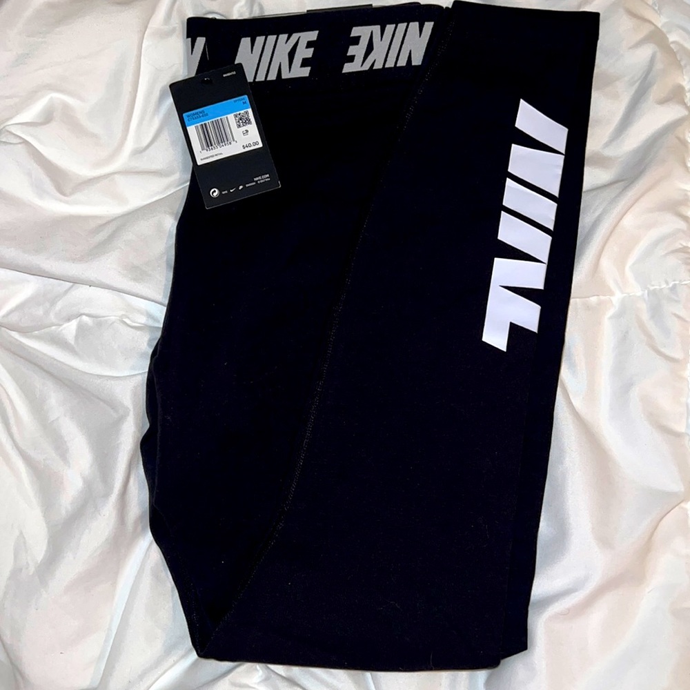Black Nike leggings with signature Nike waistband.